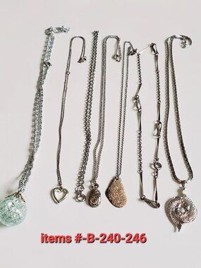 7 Silver Chain Necklaces, items # B-240-246,. wt. 50 grams.